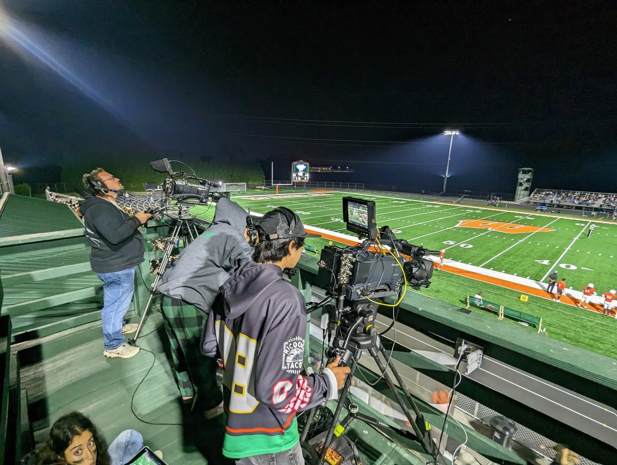 DuneVision camera operators covering a live outdoor event at night, Northwest Indiana