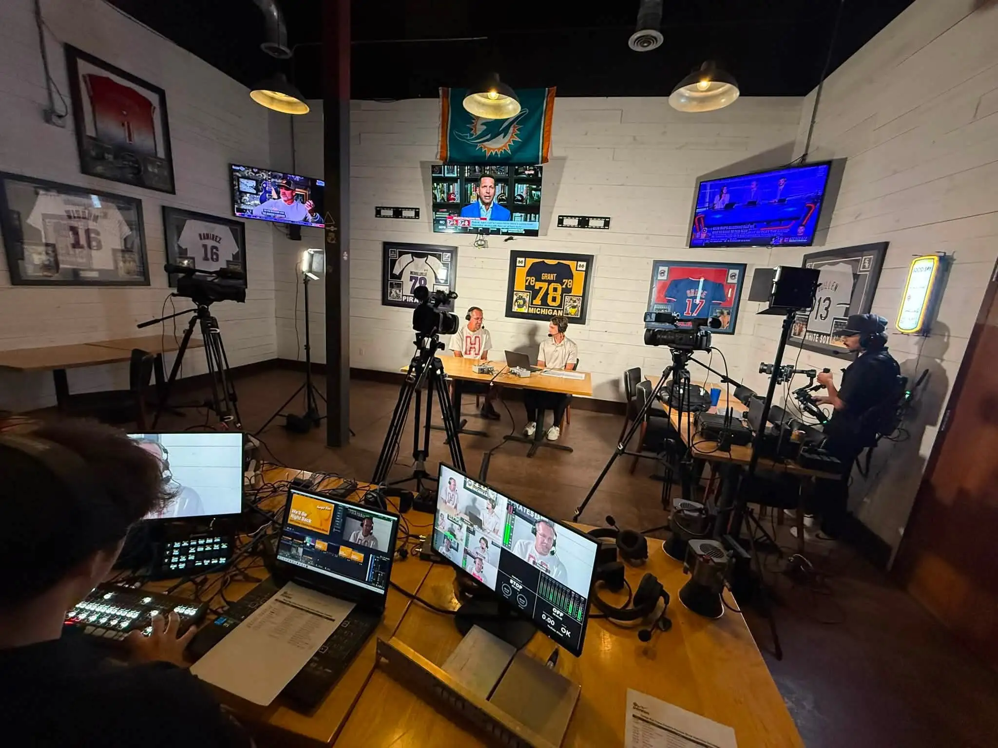 DuneVision crew at a switcher and a wall of monitors during a live show
